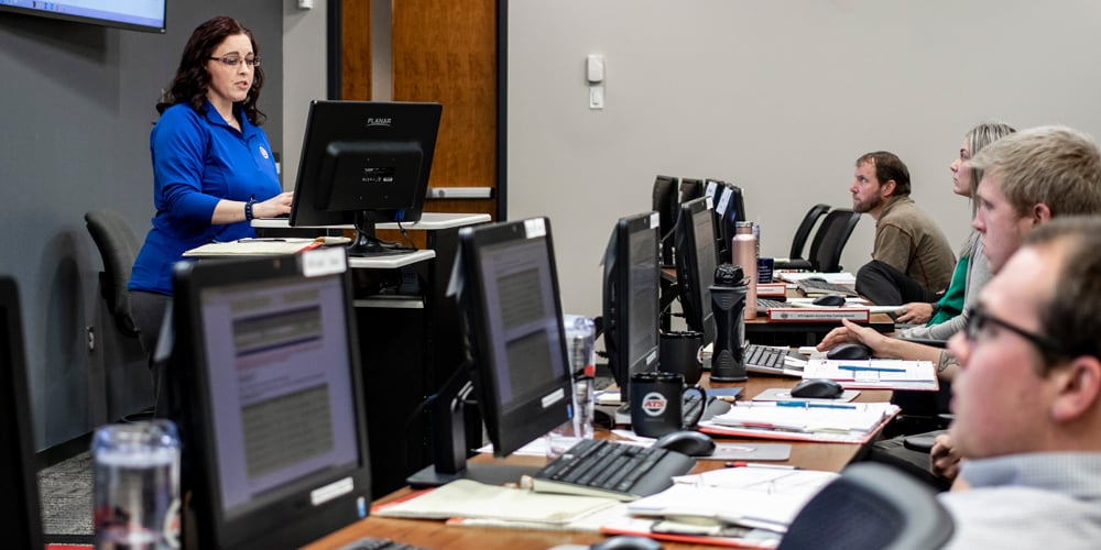 New salespeople learning in a classroom